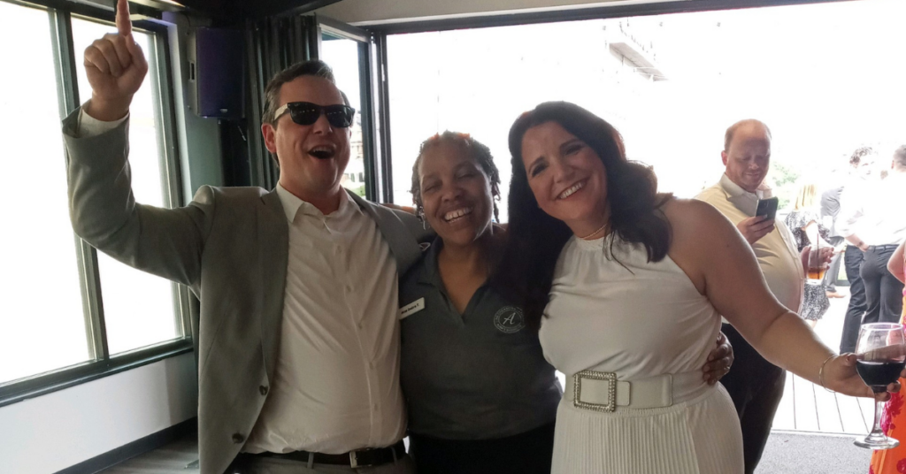 Debra Catering Manager at All Occasions Catering celebrating with bride and groom